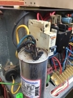 Blown air conditioner capacitor