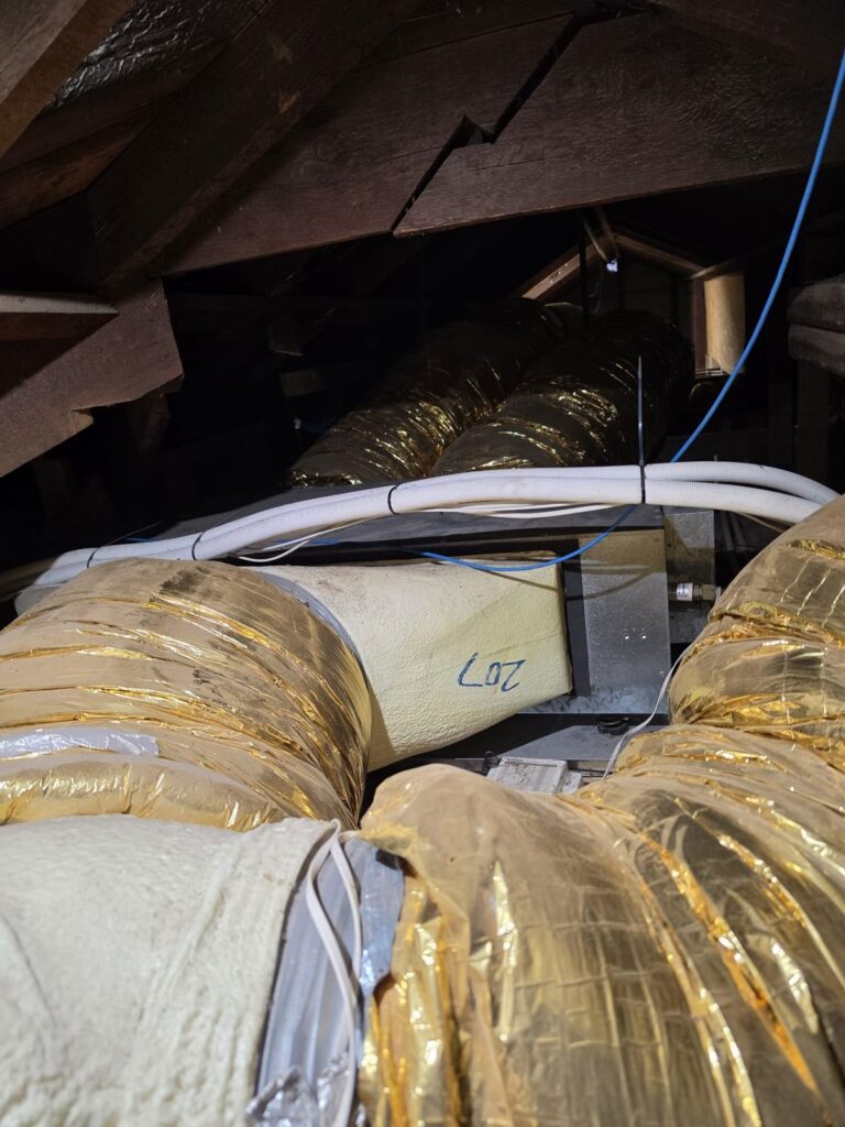 Ducted Air Conditioner Controller Upgrade: AirTouch 5 Install in Wayville 2 Insulated ducting and control cabling running through a roof space above the ceiling
